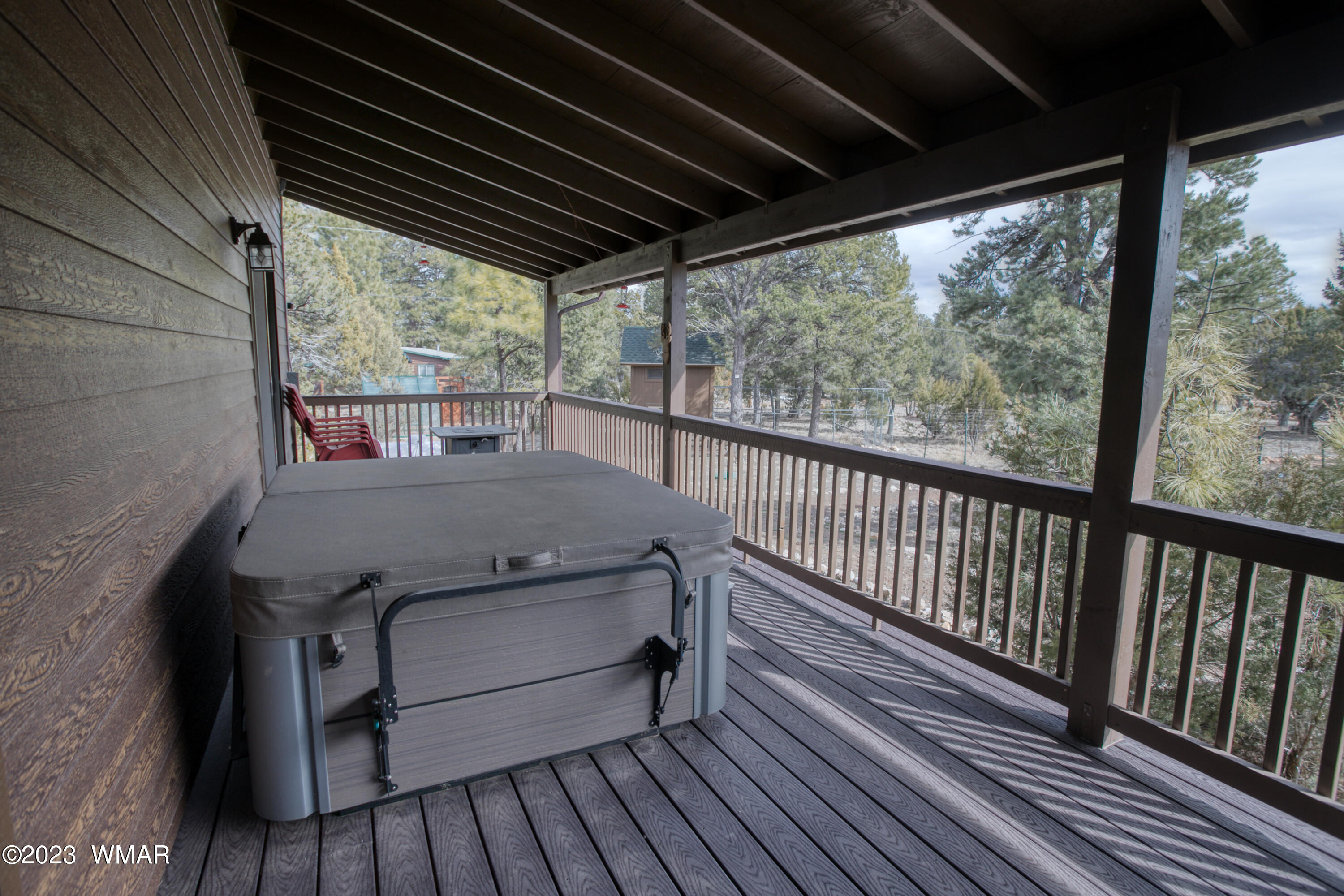 1979 Rim View Lane Heber, AZ 85928 - Photo 19 of 27 a view of balcony with wooden floor and outdoor seating