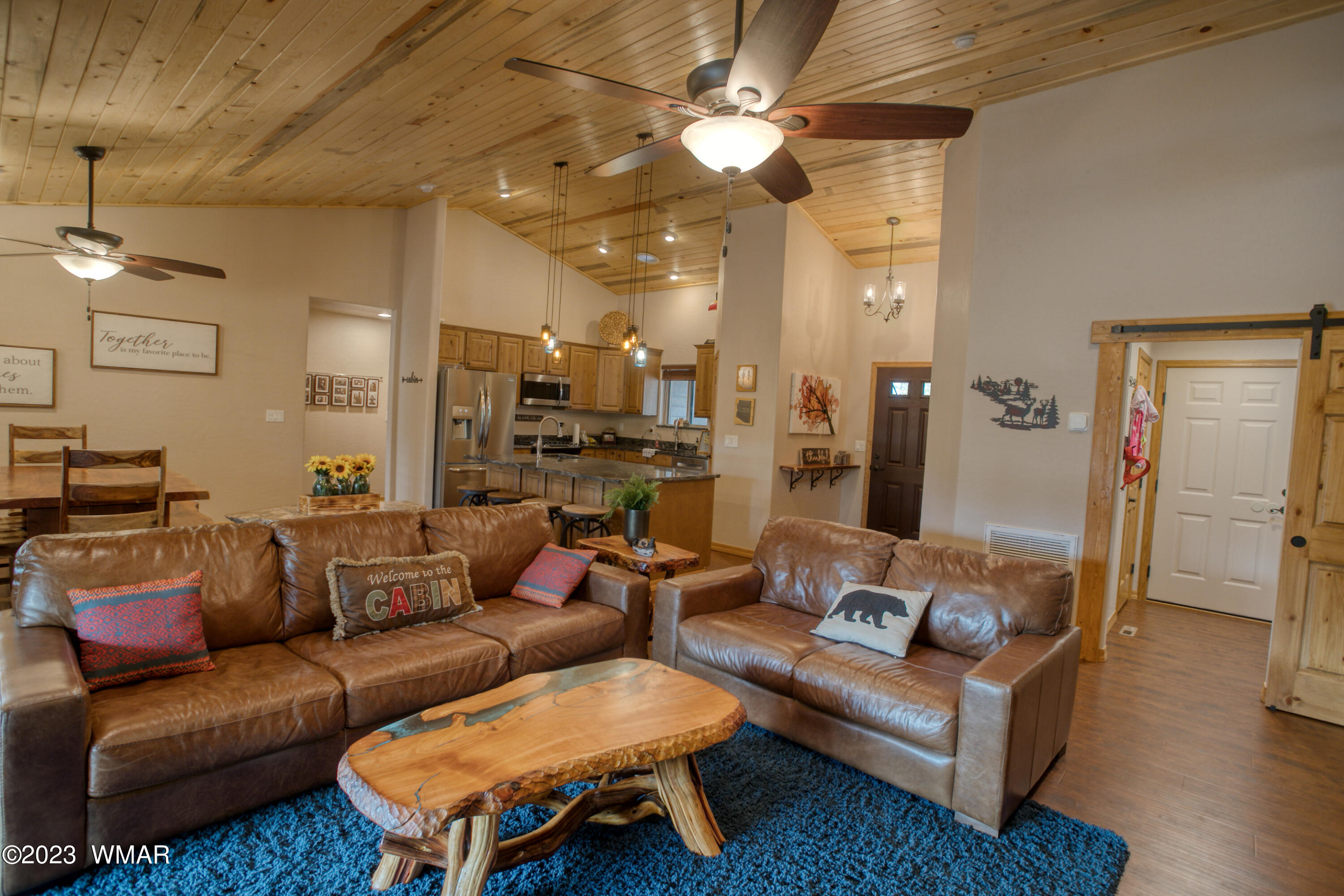 1979 Rim View Lane Heber, AZ 85928 - Photo 2 of 27 a living room with furniture and a chandelier