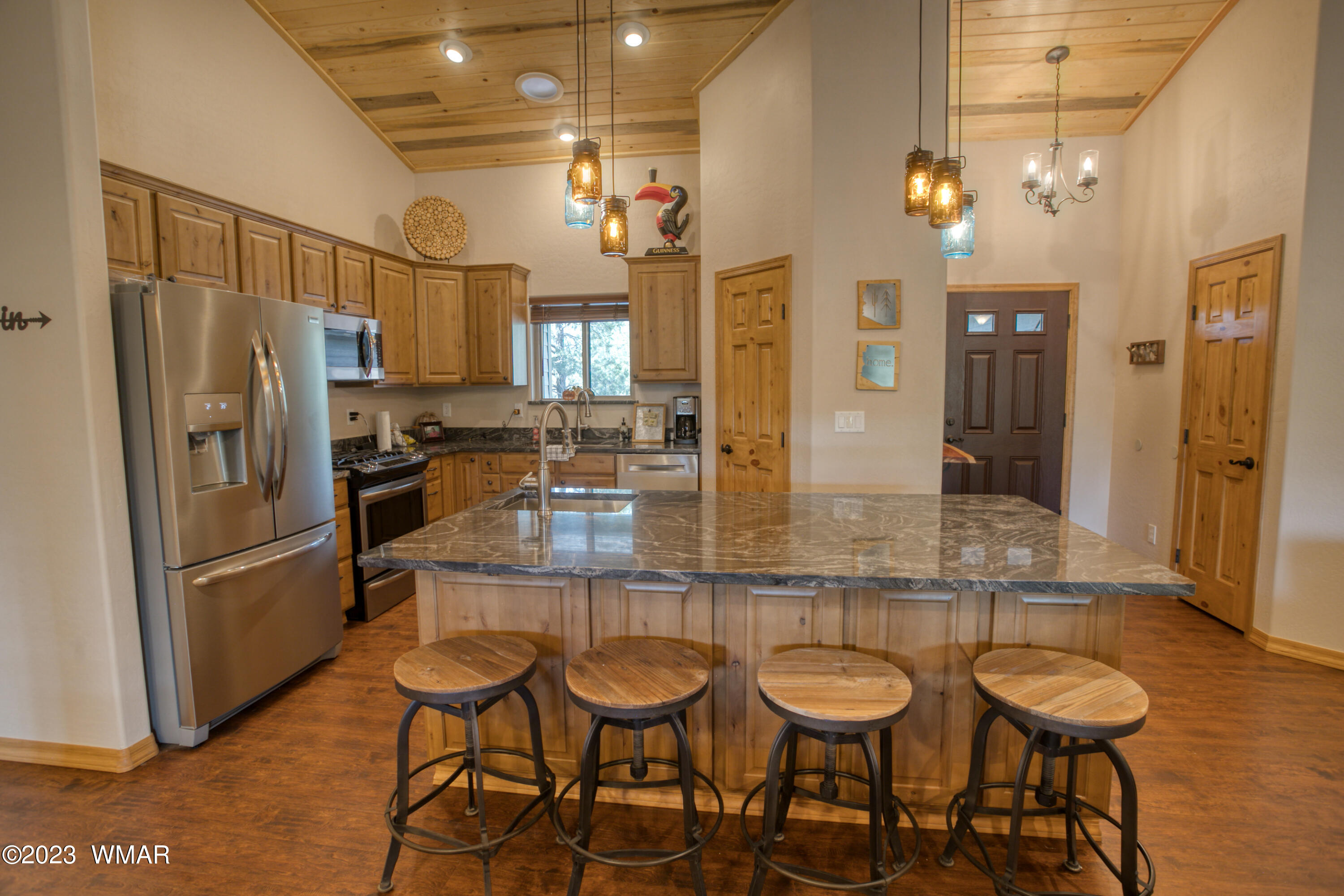 1979 Rim View Lane Heber, AZ 85928 - Photo 6 of 27 a kitchen with granite countertop a table and chairs in it