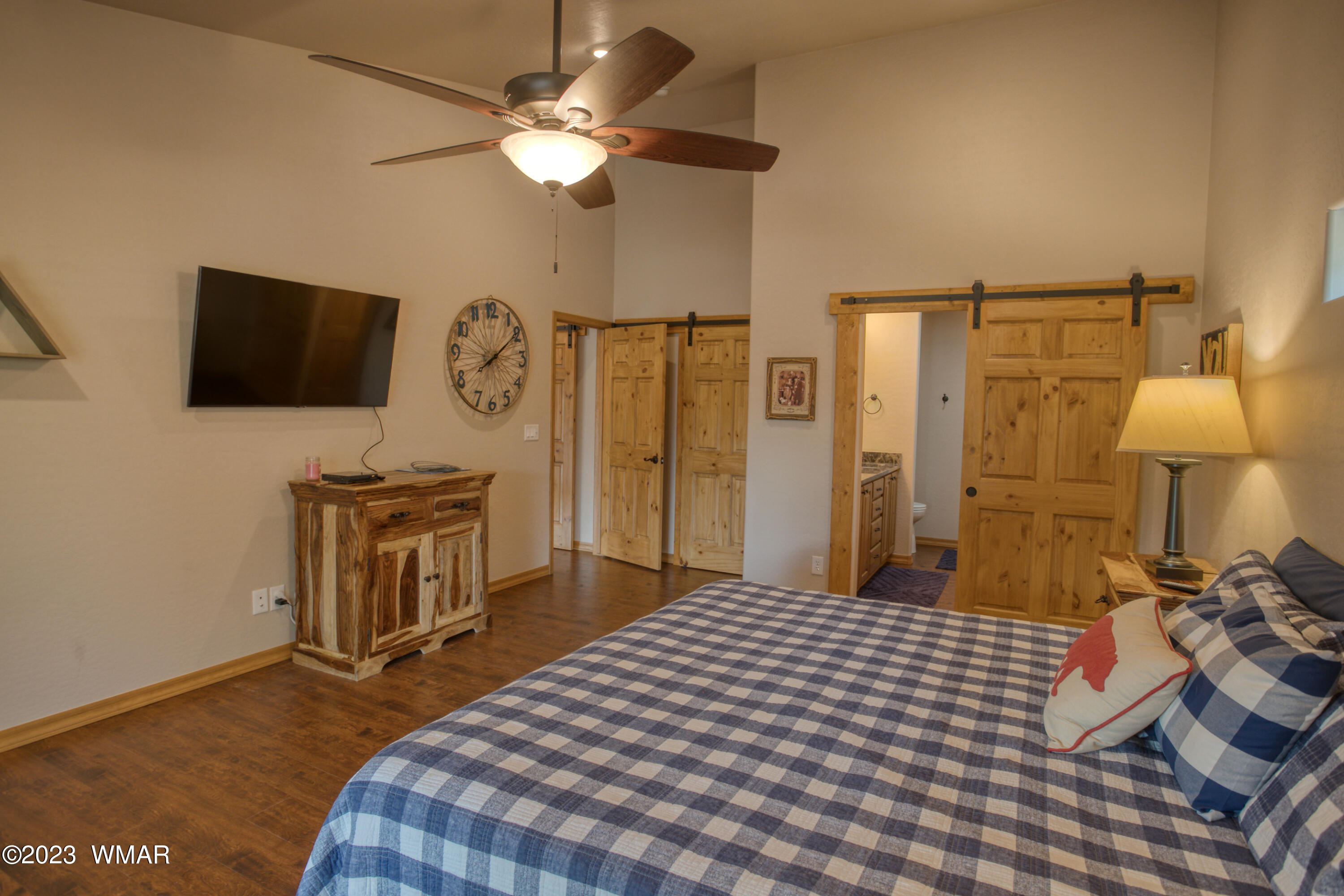 1979 Rim View Lane Heber, AZ 85928 - Photo 9 of 27 a bedroom with a bed and a flat screen tv