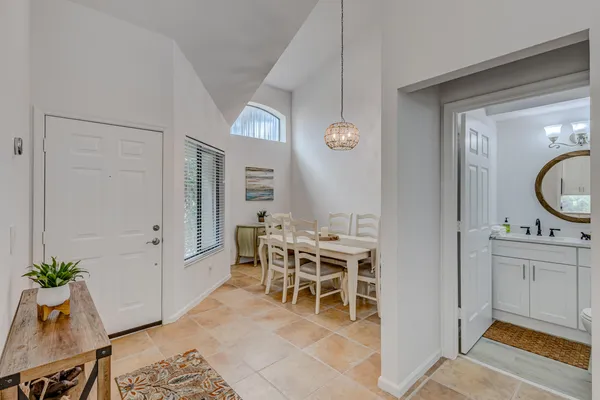 a bathroom with a sink a mirror and vanity