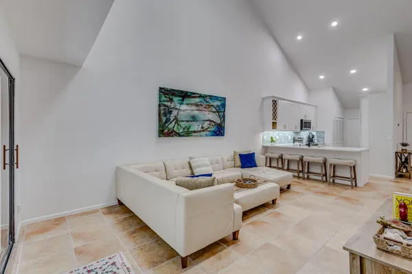 a bedroom with bed and window