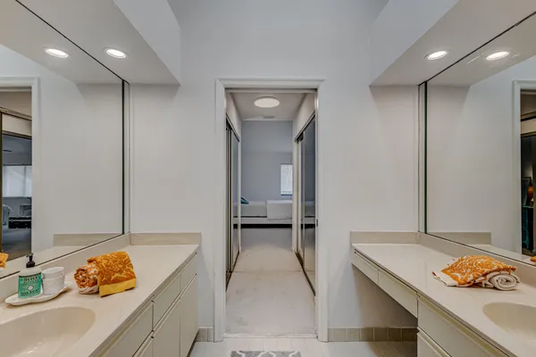 a spacious bathroom with a tub and sink