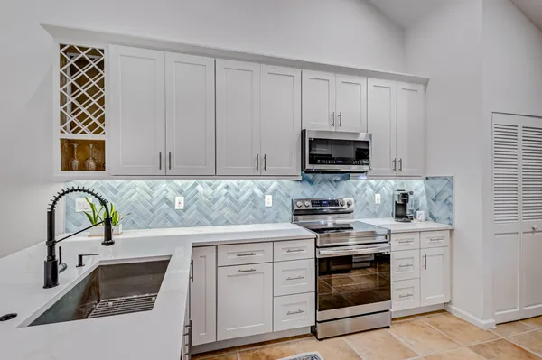 a bathroom with a sink a mirror and a window