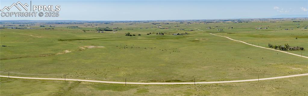 13642 Log Road Peyton, CO 80831 - Photo 21 of 29 a view of a swimming pool and an ocean view
