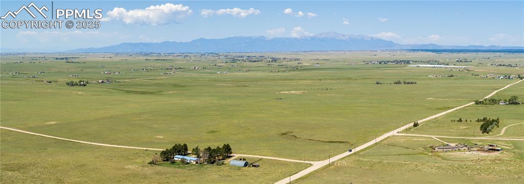 13642 Log Road Peyton, CO 80831 - Photo 24 of 29 a view of an ocean and a mountain