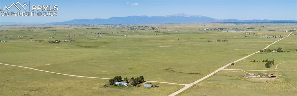 13642 Log Road Peyton, CO 80831 - Photo 8 of 29 a view of an ocean and a mountain