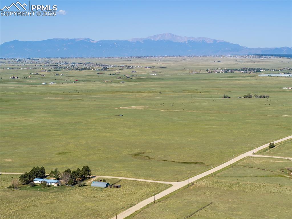 13642 Log Road Peyton, CO 80831 - Photo 9 of 29 a view of an ocean and a mountain