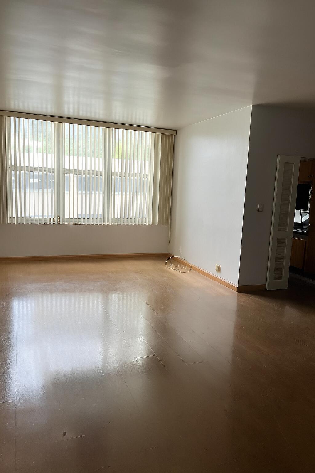 4747 Collins Avenue, Unit 305 Miami Beach, FL 33140 - Photo 11 of 12 an empty room with wooden floor and windows
