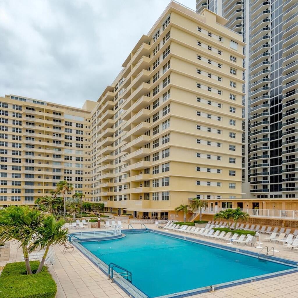 4747 Collins Avenue, Unit 305 Miami Beach, FL 33140 - Photo 2 of 12 a view of a balcony with chairs