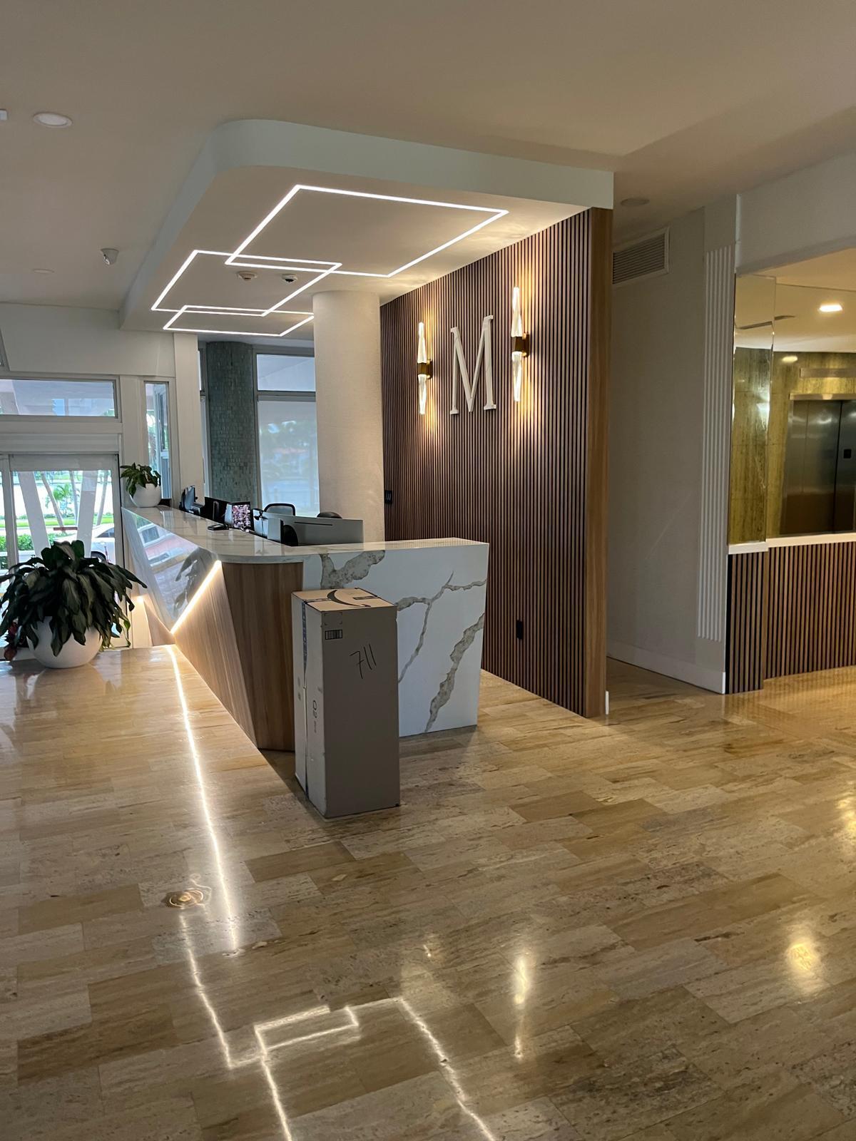 4747 Collins Avenue, Unit 305 Miami Beach, FL 33140 - Photo 3 of 12 a view of kitchen with furniture and wooden floor
