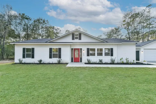 front view of a house with a garden