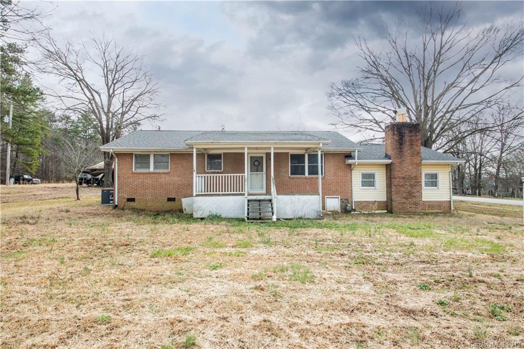 13800 Huntersville-Concord Road Huntersville, NC 28078 - Photo 1 of 16 a view of a house with a yard