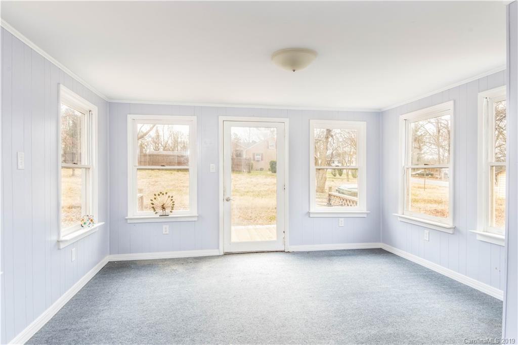 13800 Huntersville-Concord Road Huntersville, NC 28078 - Photo 3 of 16 an empty room with windows