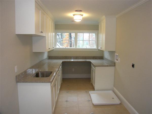 40 Skyview Lane Sudbury, MA 01776 - Photo 17 of 27 a kitchen with a sink and cabinets