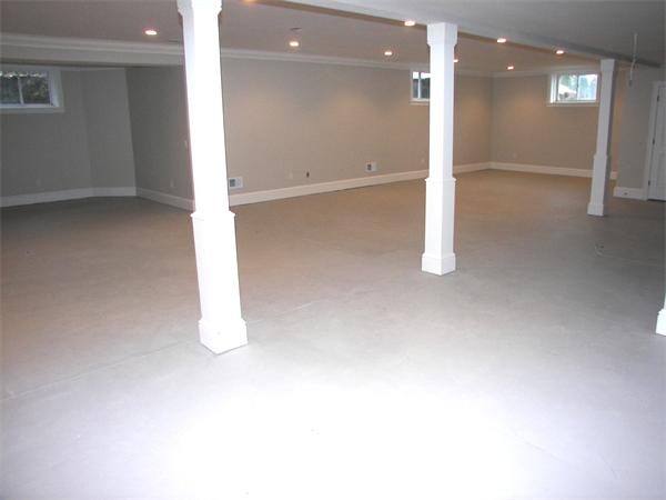 40 Skyview Lane Sudbury, MA 01776 - Photo 22 of 27 an empty room with a kitchen space and windows
