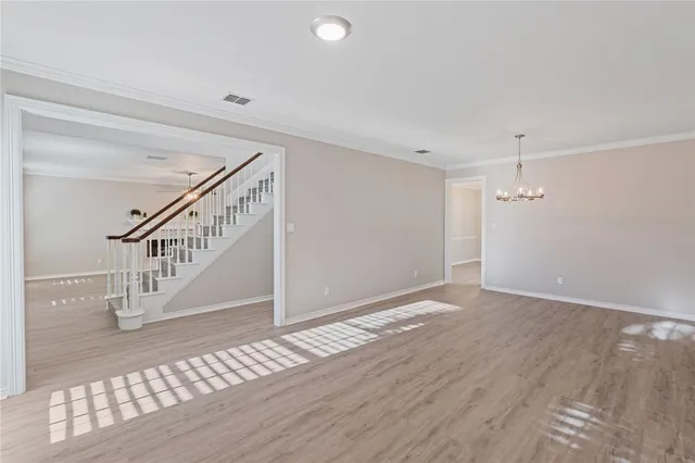 a view of an entryway with wooden floor