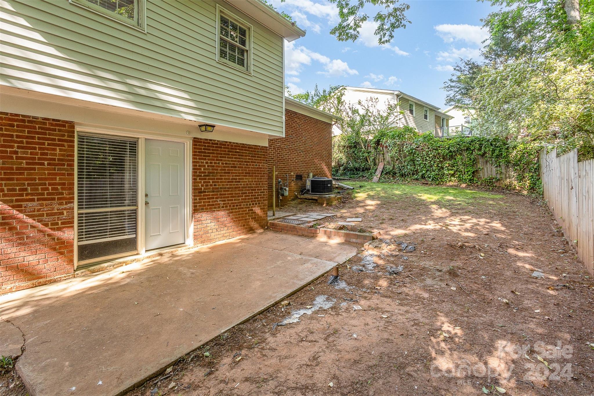 355 Sleepy Hollow Road Charlotte, NC 28217 - Photo 23 of 26 a backyard of a house with yard and outdoor seating