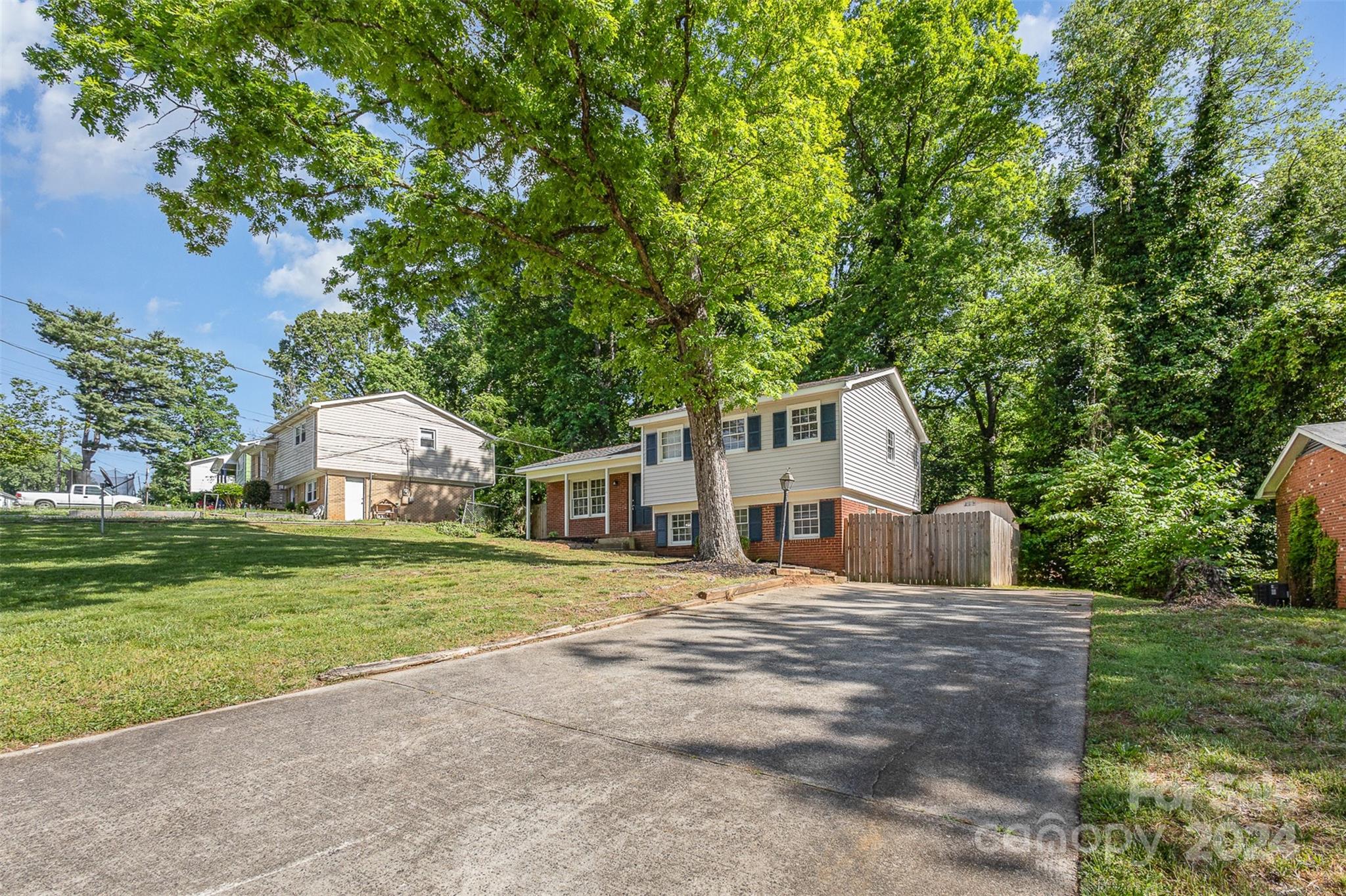 355 Sleepy Hollow Road Charlotte, NC 28217 - Photo 3 of 26 a front view of a house with a yard and garage