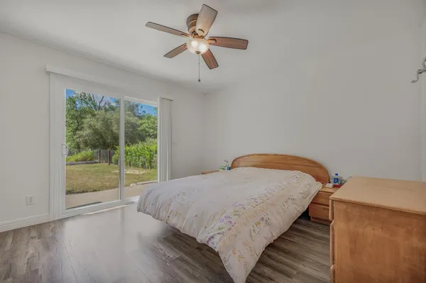 an aerial view of a house with yard and outdoor seating