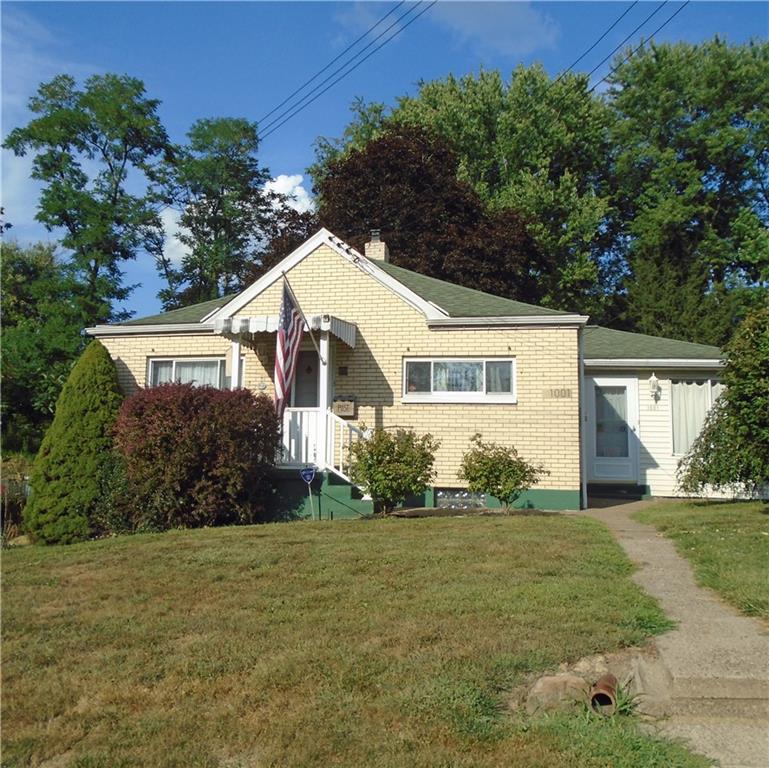 a view of house with outdoor space and garden