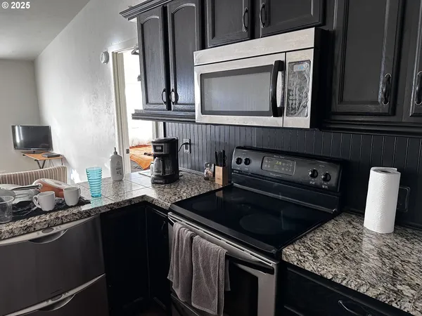 a kitchen with sink and cabinets