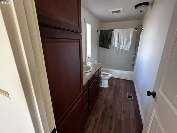 a bathroom with a sink and toilet