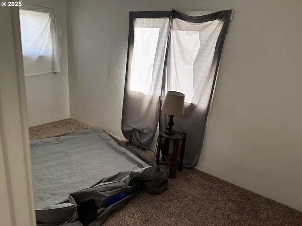 a room with chairs and window