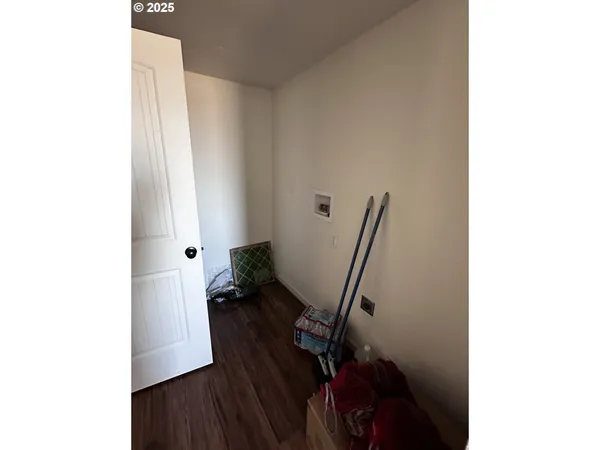 a view of a hallway with furniture and stairs