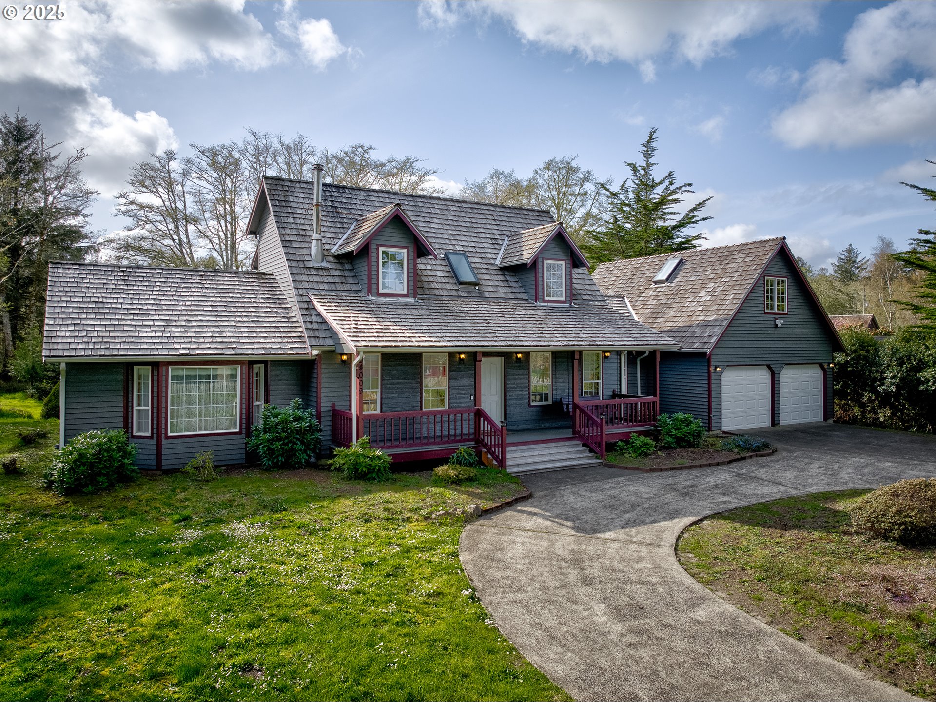34009 Territory Road Oysterville, WA 98641 - Photo 1 of 39 a front view of a house with garden