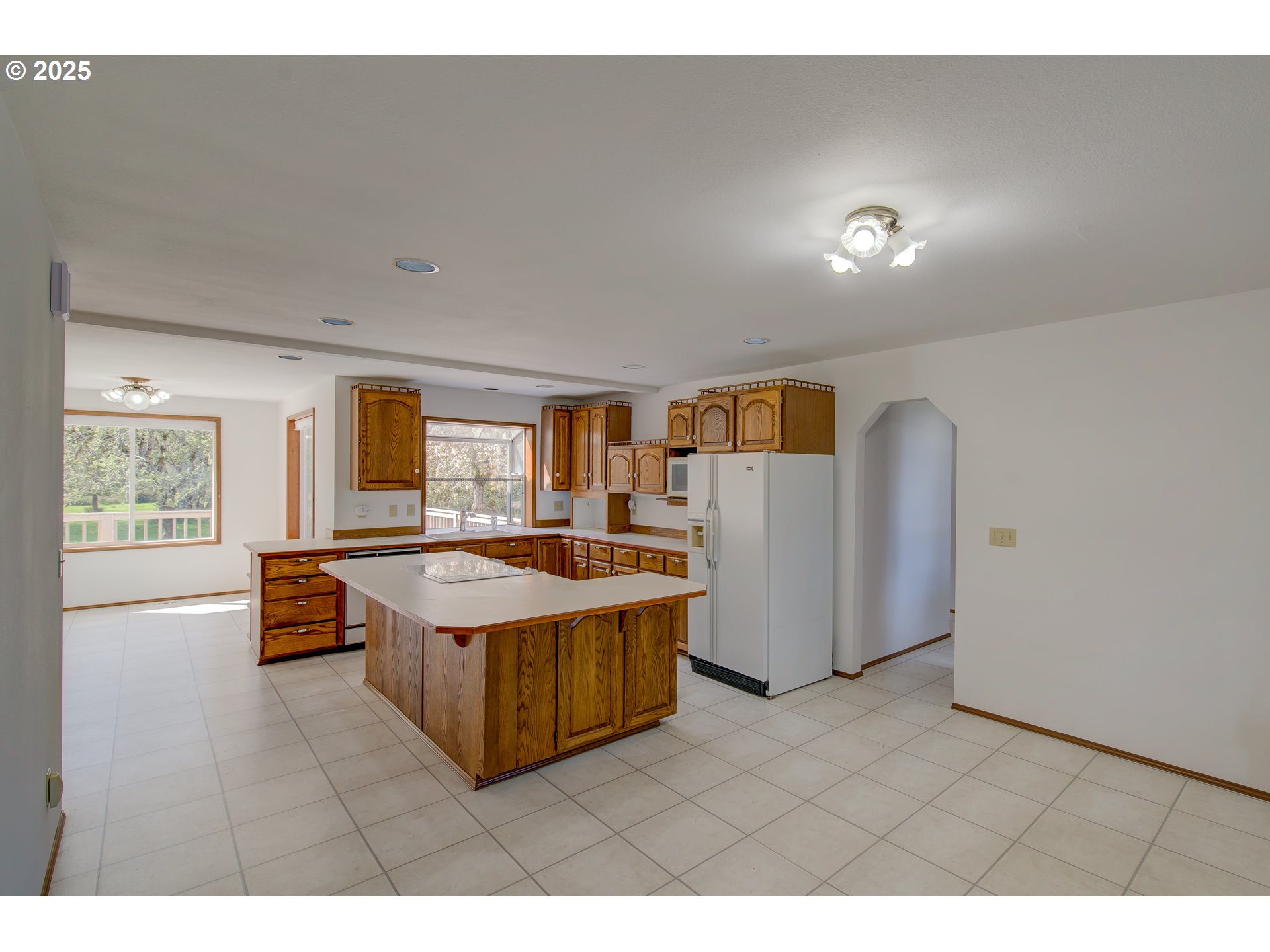 34009 Territory Road Oysterville, WA 98641 - Photo 15 of 39 a living room with furniture and a flat screen tv