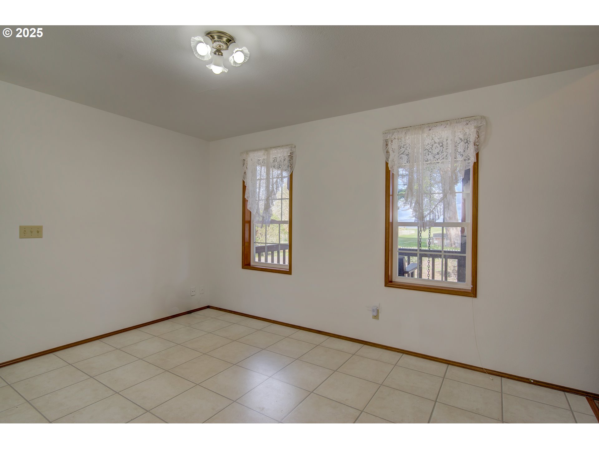 34009 Territory Road Oysterville, WA 98641 - Photo 16 of 39 a view of an empty room with a window