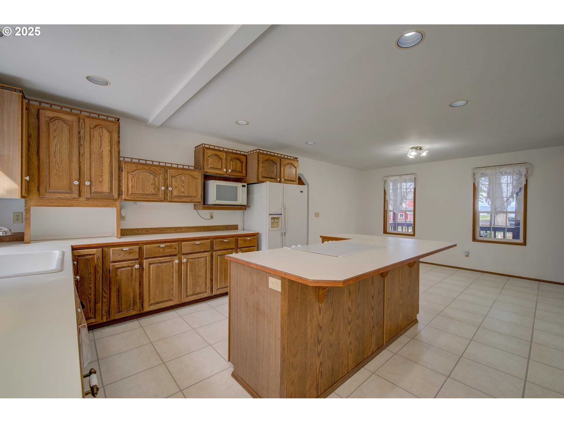 34009 Territory Road Oysterville, WA 98641 - Photo 18 of 39 a kitchen that has a sink and a stove in it