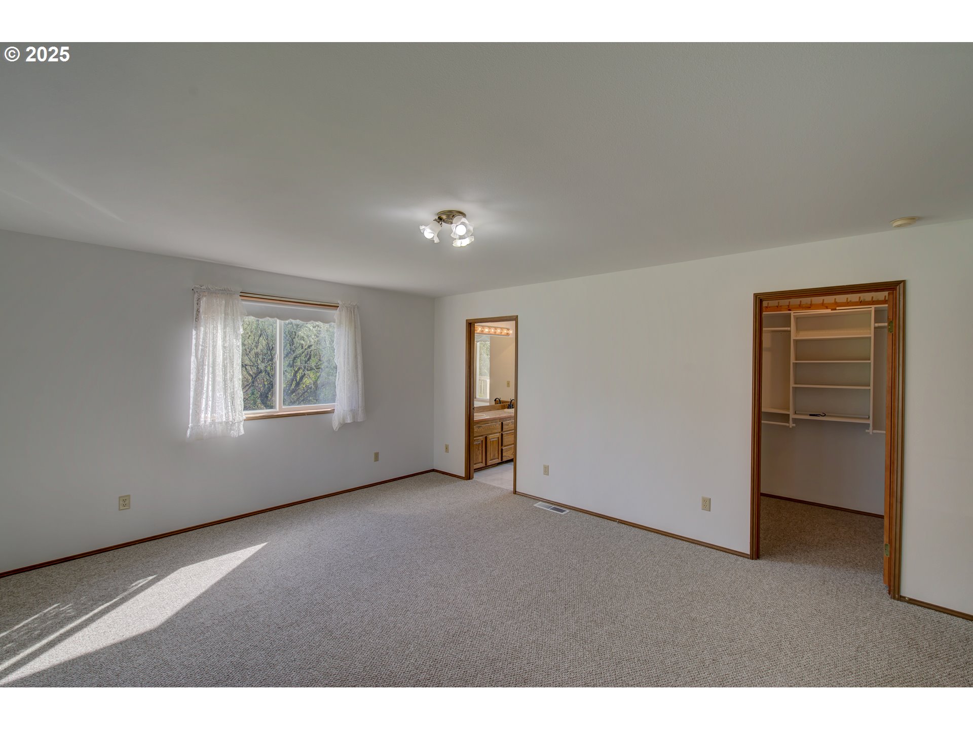 34009 Territory Road Oysterville, WA 98641 - Photo 22 of 39 a view of an empty room with a window