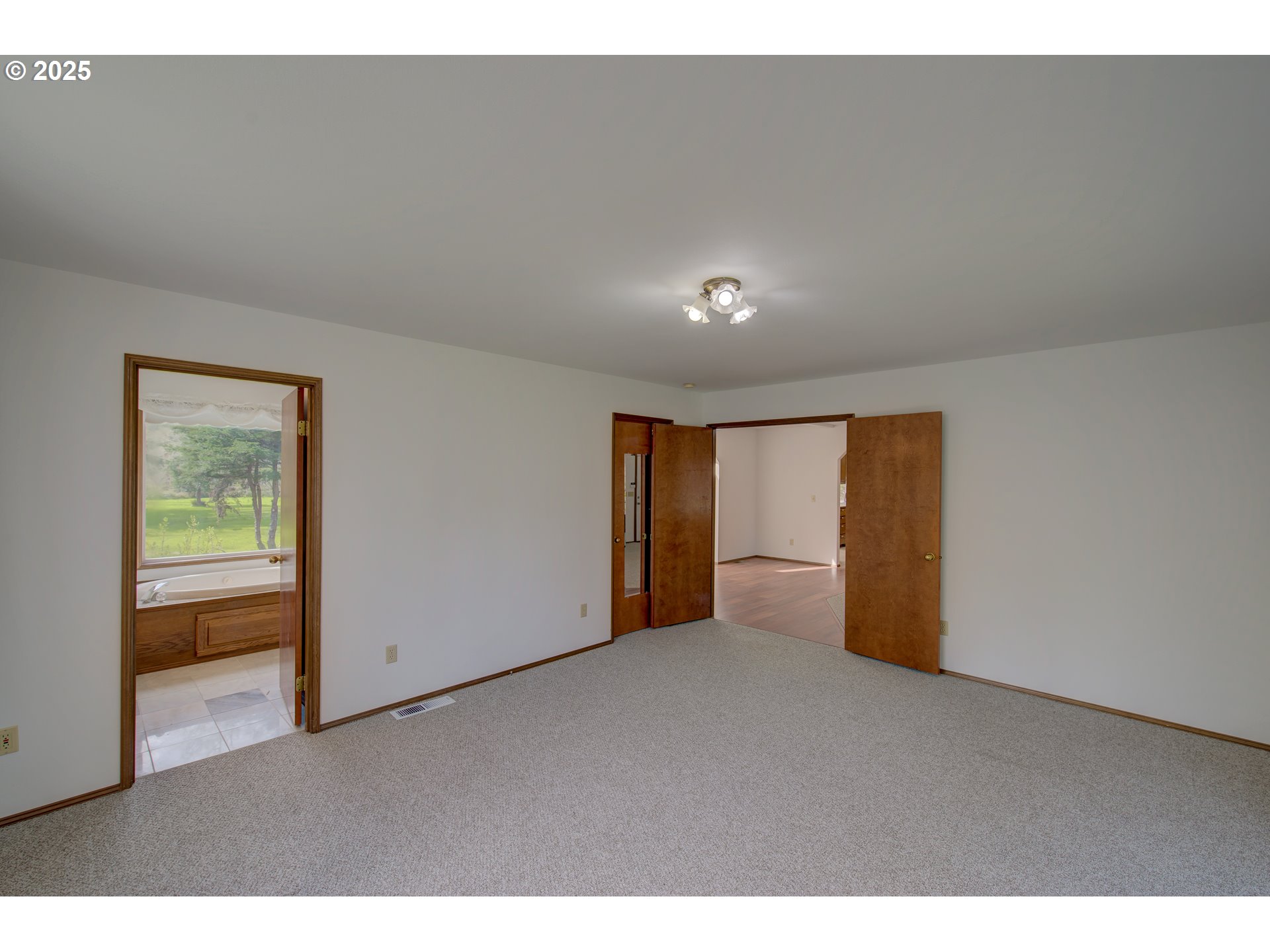 34009 Territory Road Oysterville, WA 98641 - Photo 24 of 39 a view of an empty room with a window