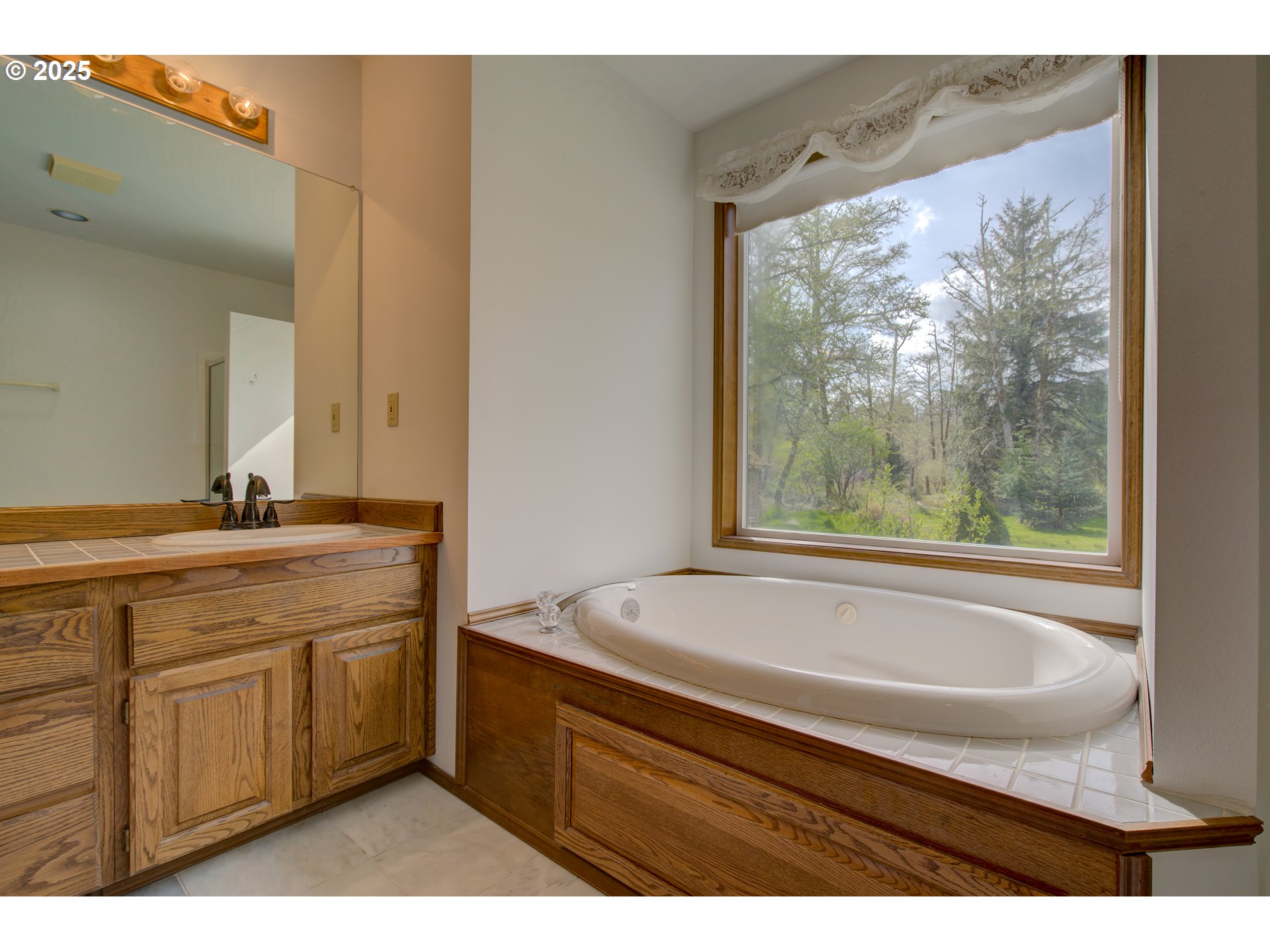 34009 Territory Road Oysterville, WA 98641 - Photo 25 of 39 a bathroom with a sink and a bathtub