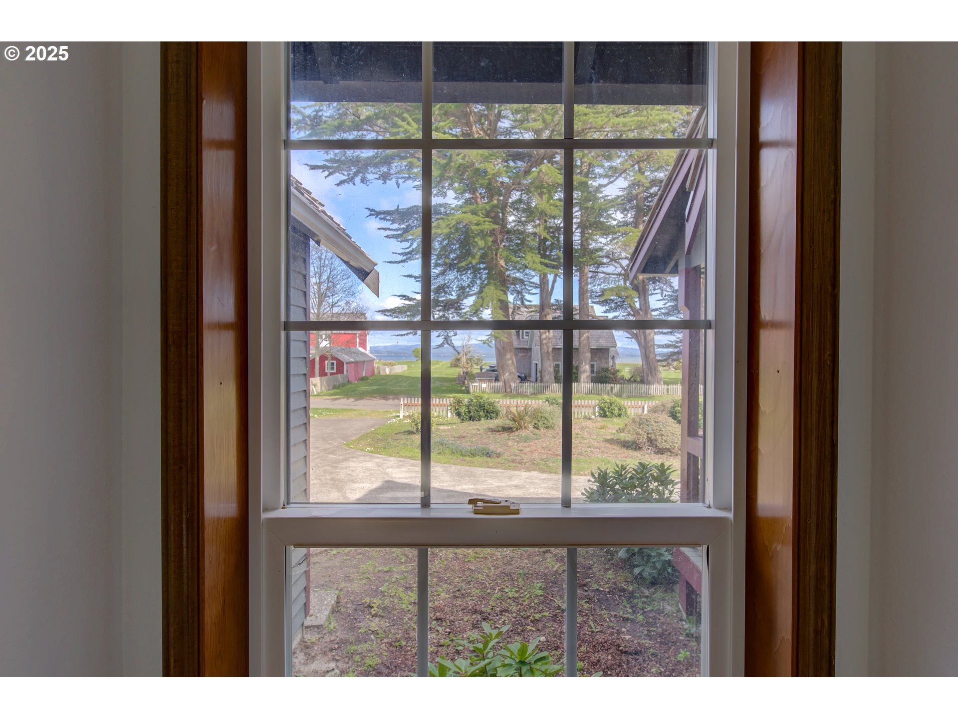 34009 Territory Road Oysterville, WA 98641 - Photo 27 of 39 a view of a glass door with a yard from a window