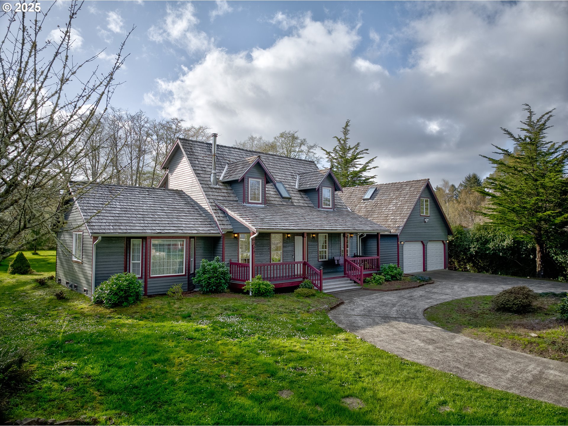 34009 Territory Road Oysterville, WA 98641 - Photo 3 of 39 a front view of house with yard and green space