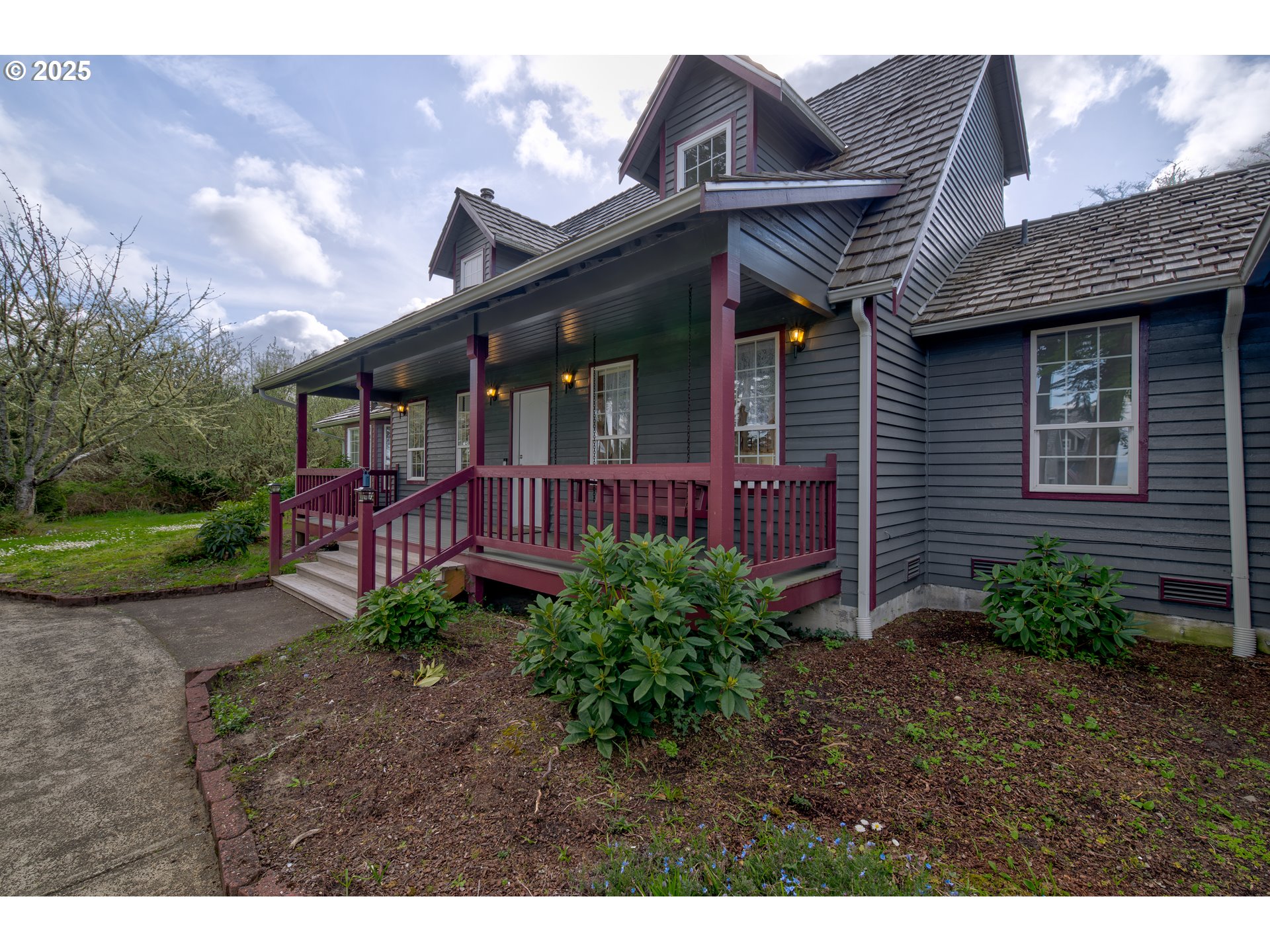 34009 Territory Road Oysterville, WA 98641 - Photo 4 of 39 a view of a house with brick walls and a yard