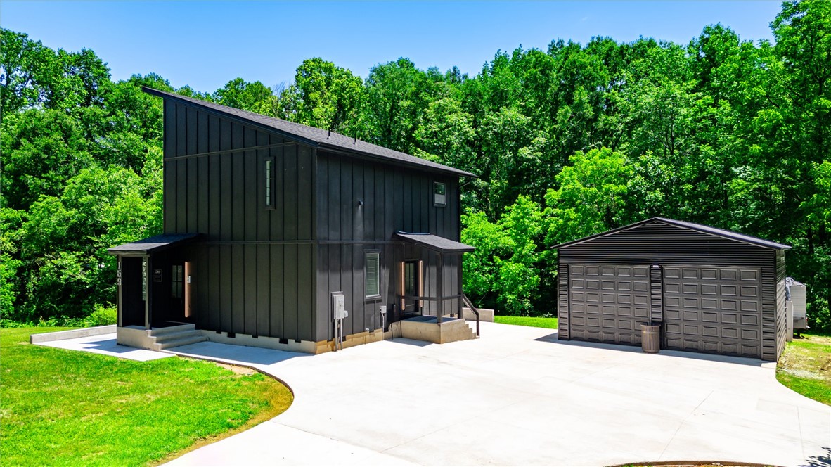 159 Cherokee Trail Easley, SC 29640 - Photo 27 of 38 Modern architecture meets nature in this secluded forest retreat with a convenient detached garage.