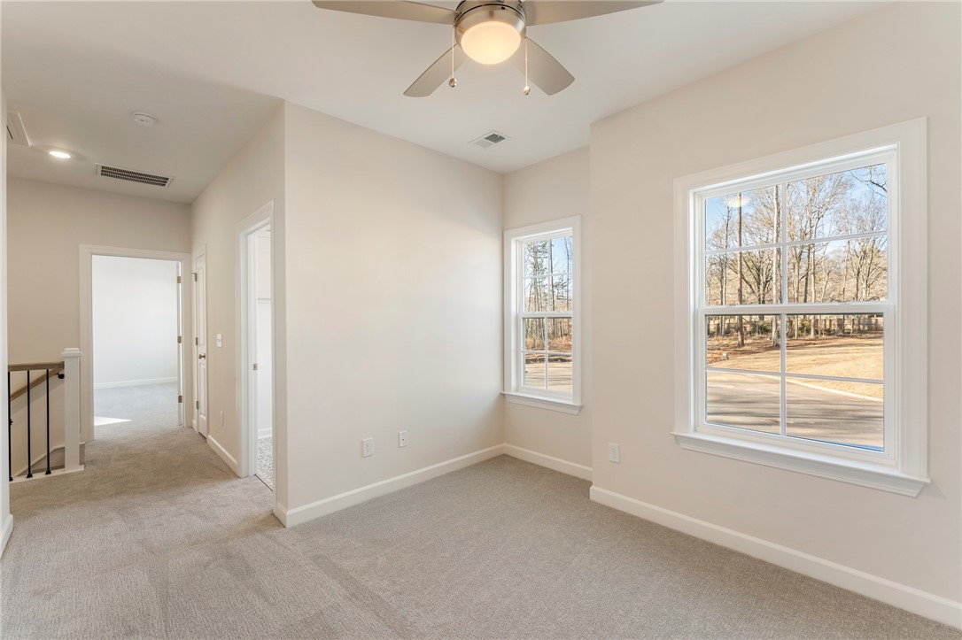 707 Weathered Oak Way Anderson, SC 29621 - Photo 19 of 28 This airy room offers a comfortable space with ample natural light.