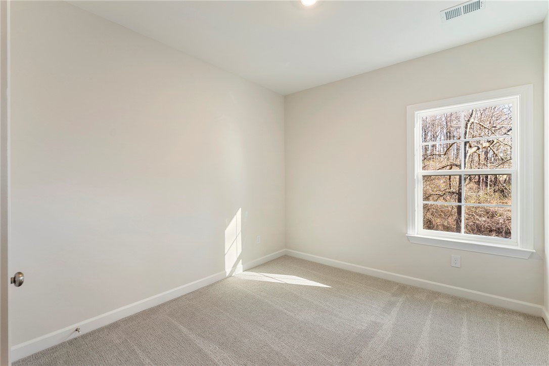 707 Weathered Oak Way Anderson, SC 29621 - Photo 25 of 28 This bright, airy room features plush carpeting and a large window framing picturesque views.