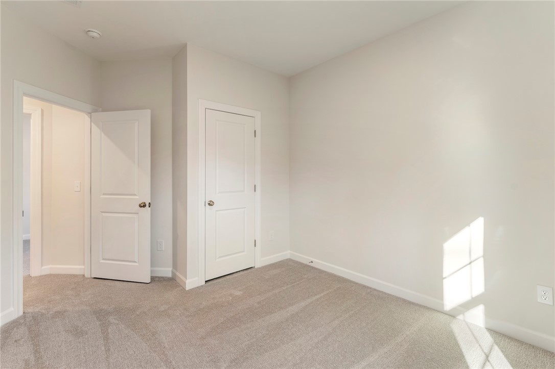 707 Weathered Oak Way Anderson, SC 29621 - Photo 26 of 28 Bright and airy, this room offers plush carpet flooring, ready for your personal touch.