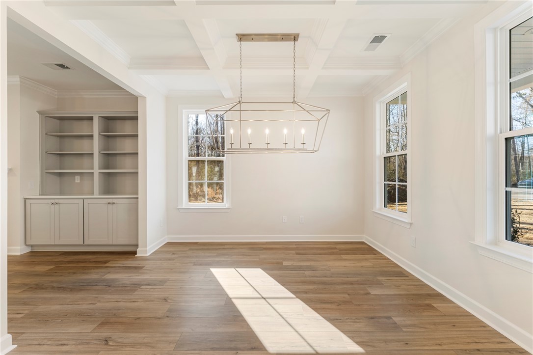 707 Weathered Oak Way Anderson, SC 29621 - Photo 3 of 28 This bright space features a striking chandelier and durable flooring, ideal for everyday living.