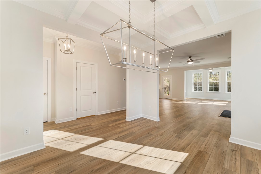 707 Weathered Oak Way Anderson, SC 29621 - Photo 28 of 28 This bright interior features an open floorplan with durable flooring and stylish lighting.