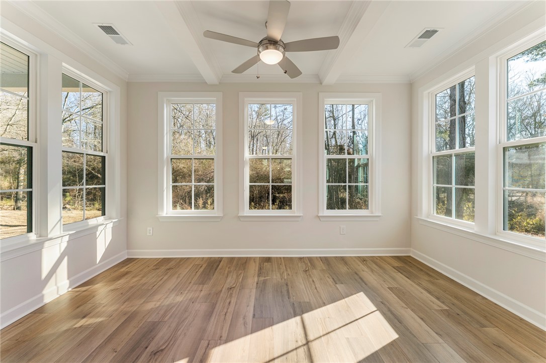 707 Weathered Oak Way Anderson, SC 29621 - Photo 8 of 28 This bright sunroom features expansive windows and durable flooring, ideal for a cheerful living space.