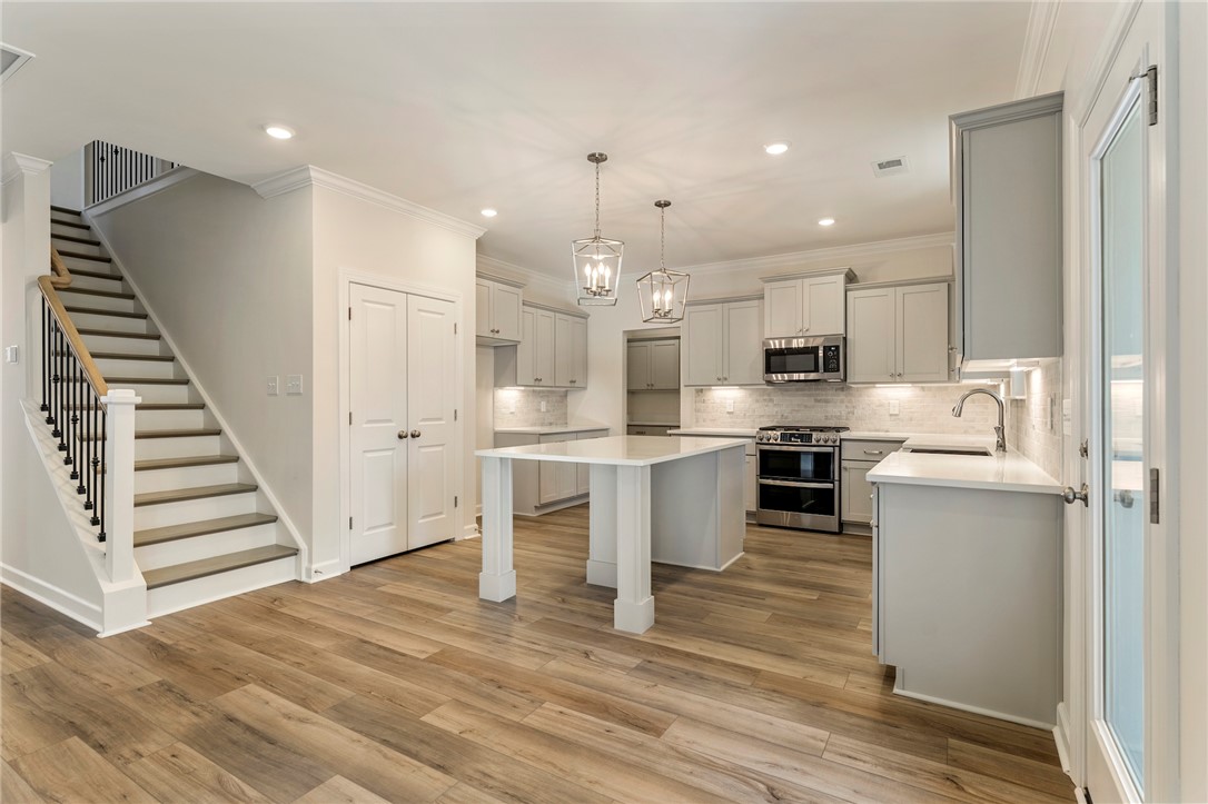 707 Weathered Oak Way Anderson, SC 29621 - Photo 9 of 28 This spacious interior features a bright kitchen and convenient staircase, perfect for everyday living.