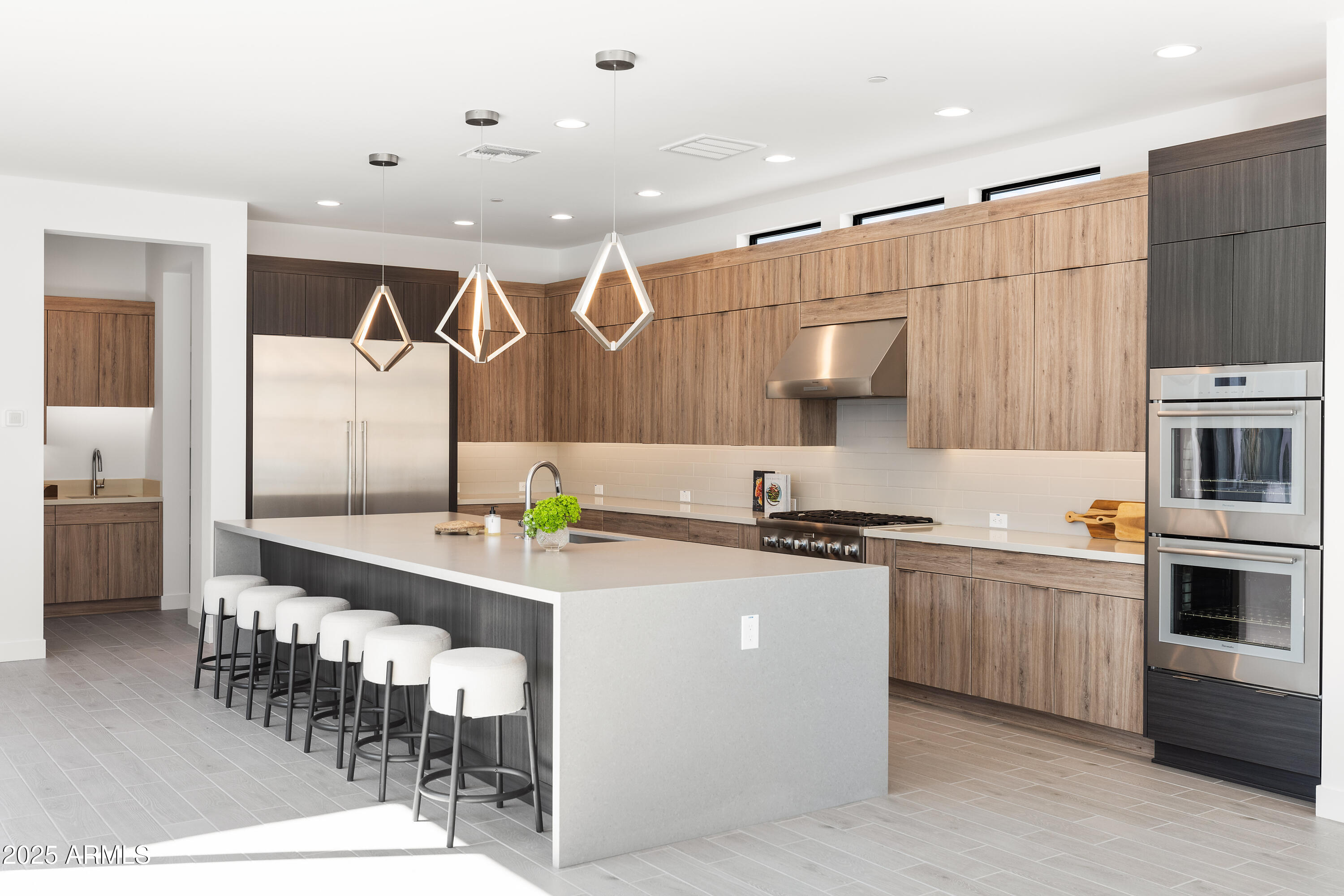 13238 East Ranch Gate Road Scottsdale, AZ 85255 - Photo 11 of 66 a kitchen with stainless steel appliances granite countertop a sink and cabinets