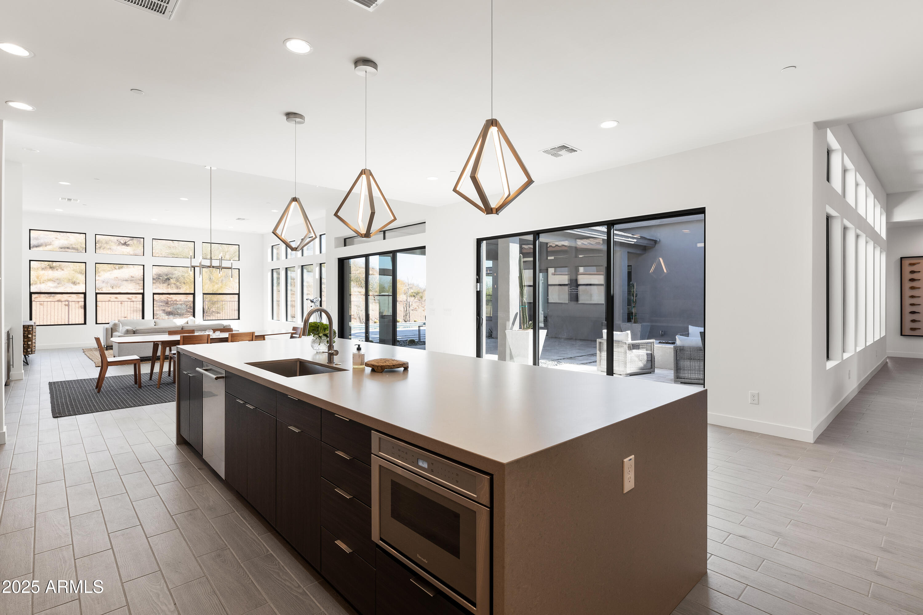 13238 East Ranch Gate Road Scottsdale, AZ 85255 - Photo 15 of 66 a large kitchen with granite countertop a sink and dishwasher with a large kitchen island