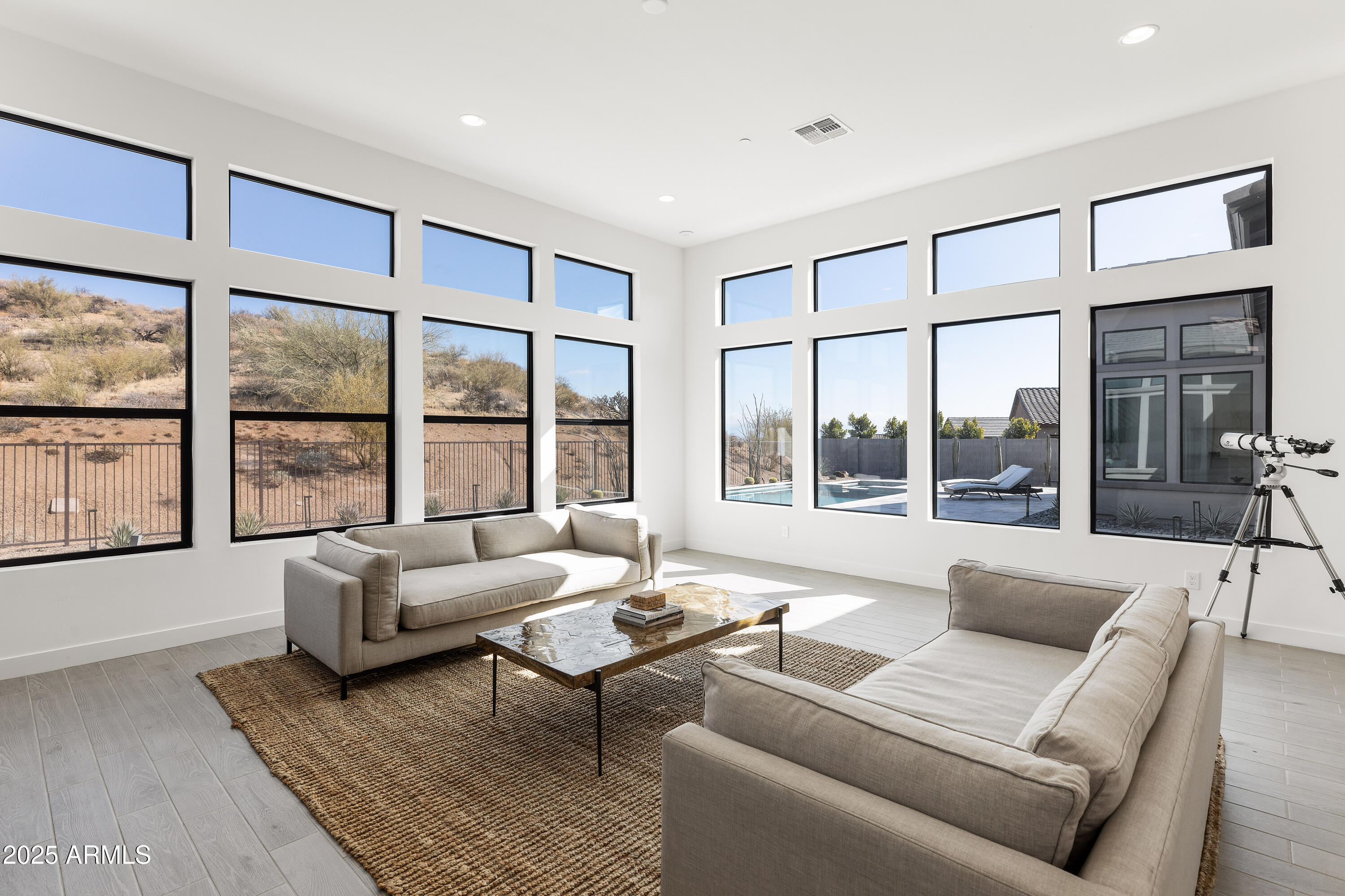 13238 East Ranch Gate Road Scottsdale, AZ 85255 - Photo 20 of 66 a living room with furniture and floor to ceiling windows